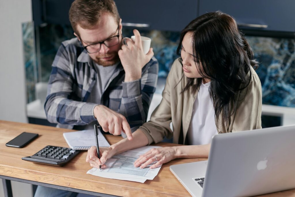 Couple Calculating all their investments